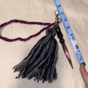 Pink and black resin self defense keychain with white feather